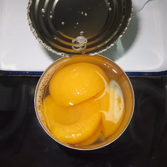 Frutas enlatadas Mitades de durazno amarillo fresco enlatado en almíbar ligero/espeso
